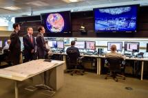 Britain's Chancellor of the Exchequer George Osborne is shown the 24 hour Operations Room inside GCHQ, by the Director of GCHQ Robert Hannigan (C) and Cheltenham MP Alex Chalk (L), in Cheltenham